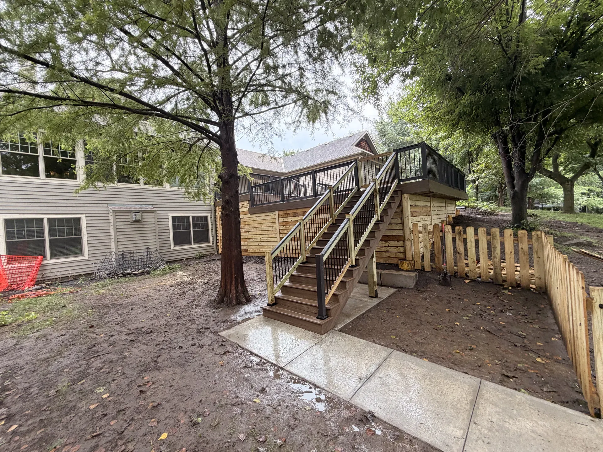 Deck with horizontal wood skirting and side stair access