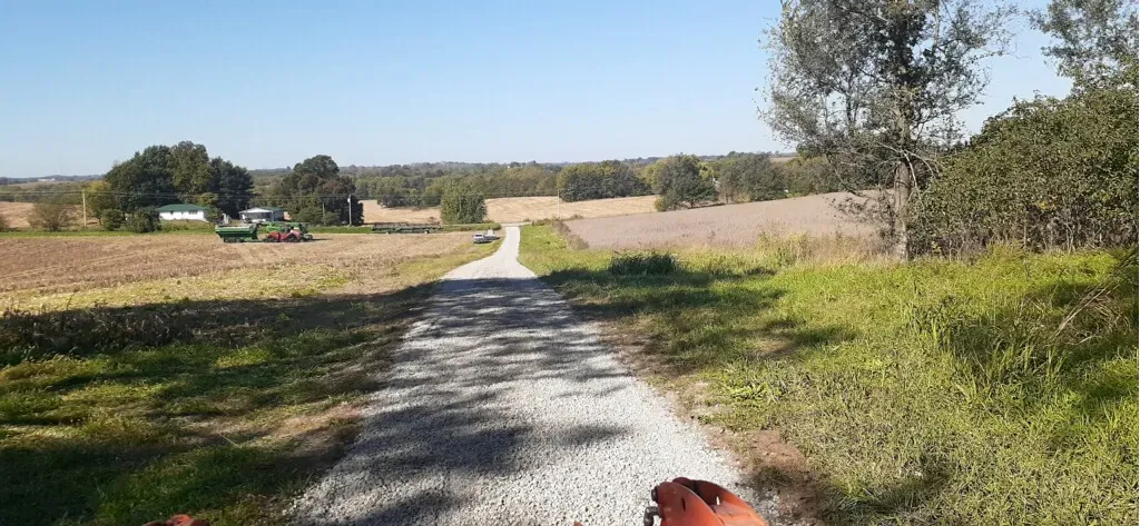 Gravel driveway leading to barn in Clay County