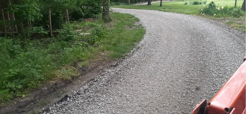 Gravel driveway work with equipment on site