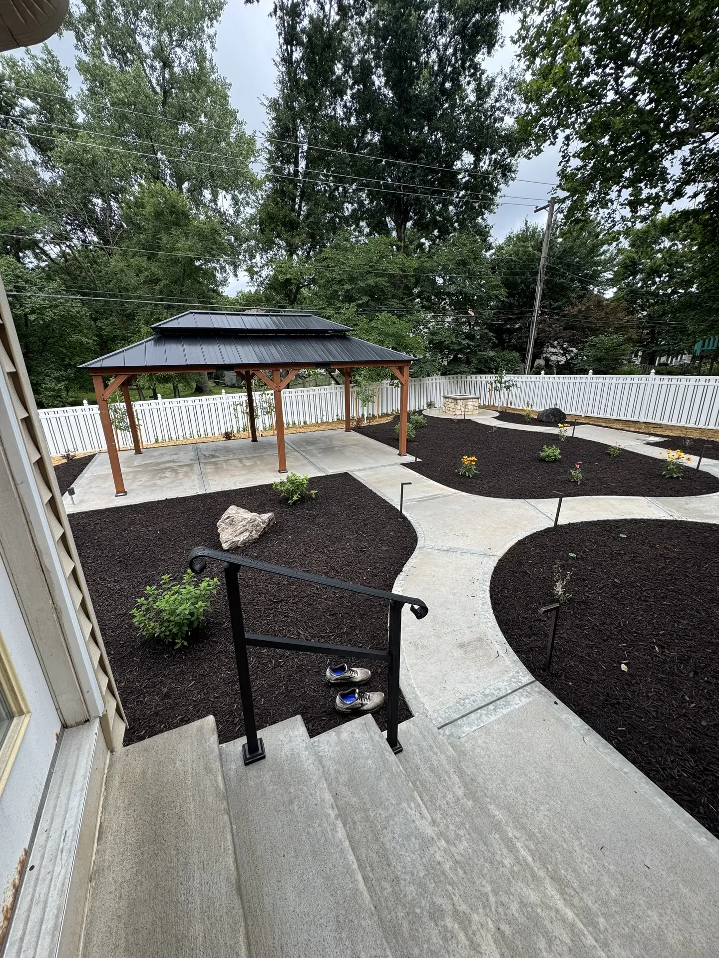 Aerial view of completed backyard project with multiple features
