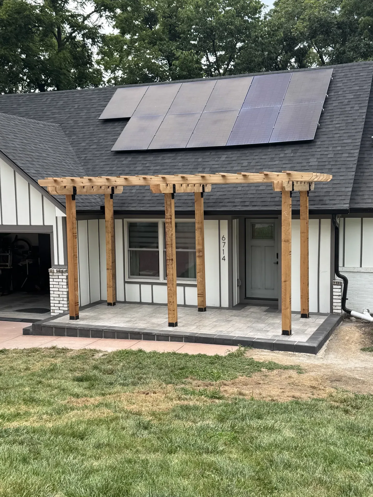 Paver front entry with pergola installed by Jostmeyer Land Solutions