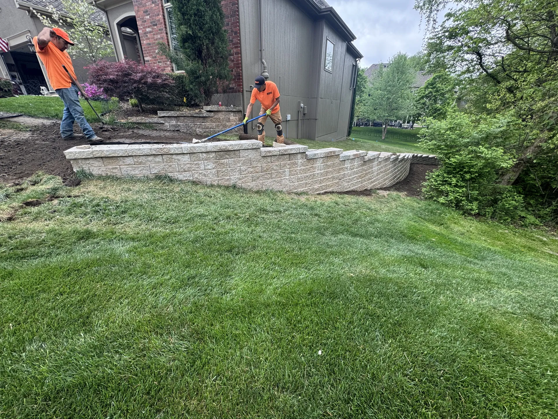 Retaining wall with patio steps and crew