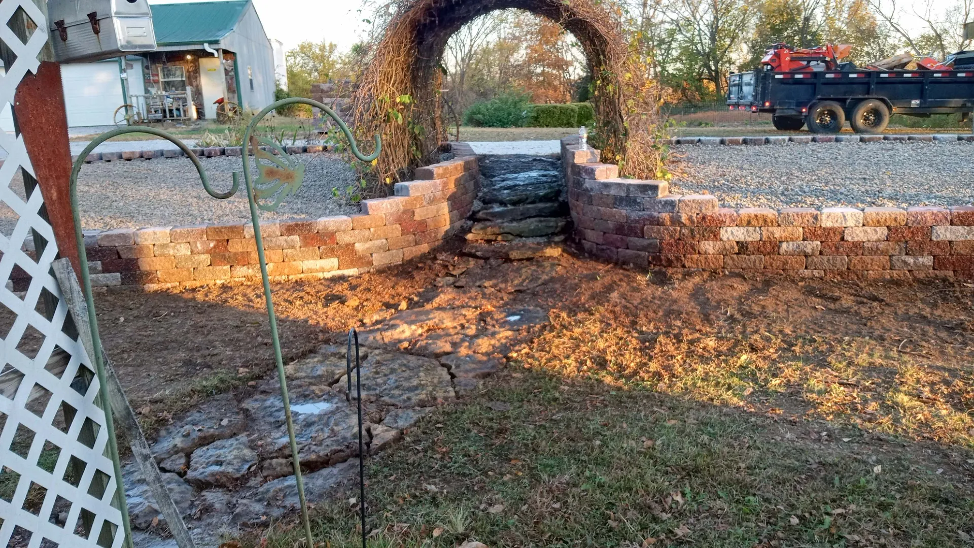 Stone arch retaining wall under construction