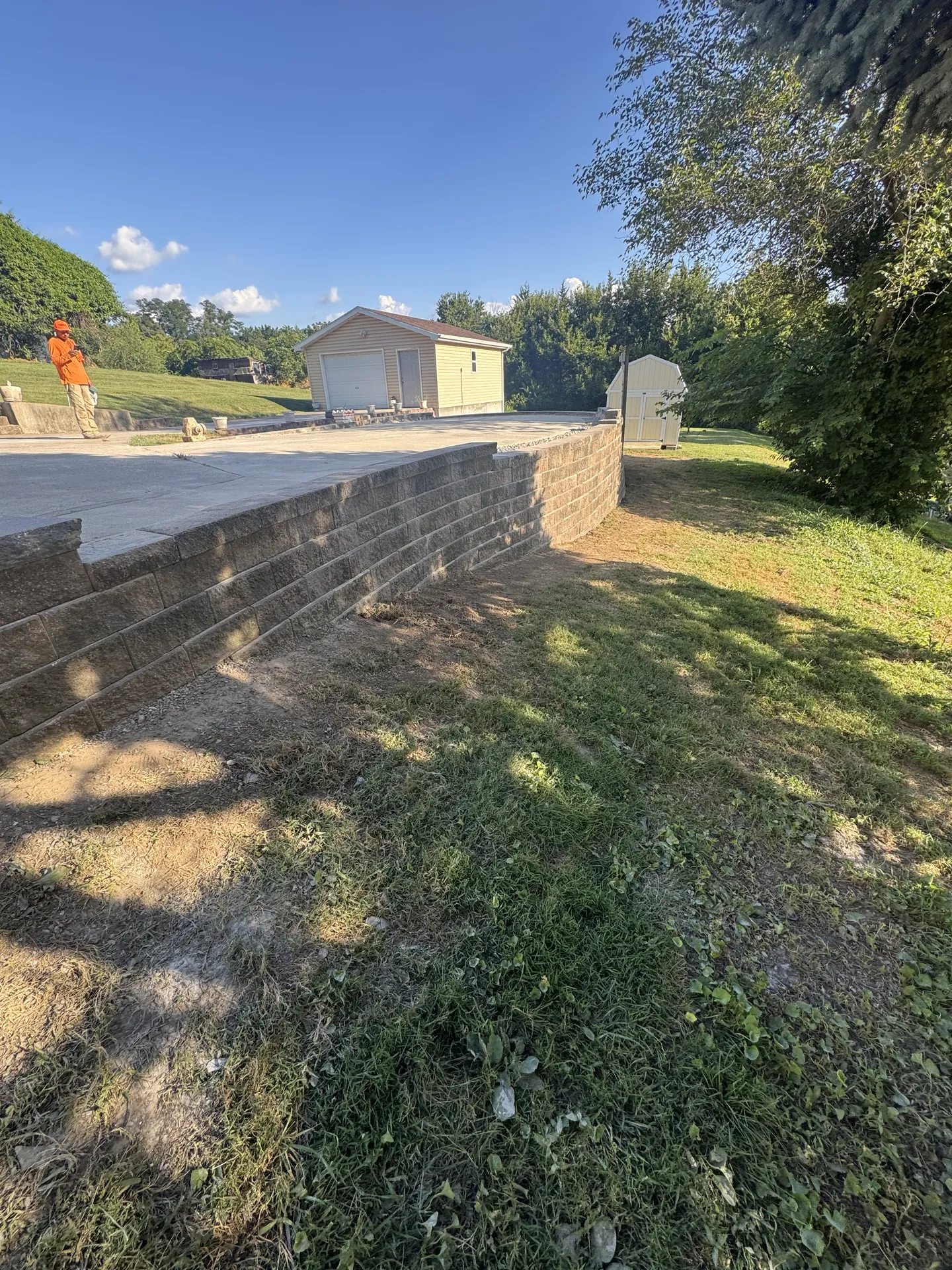 Tall straight retaining wall on property line